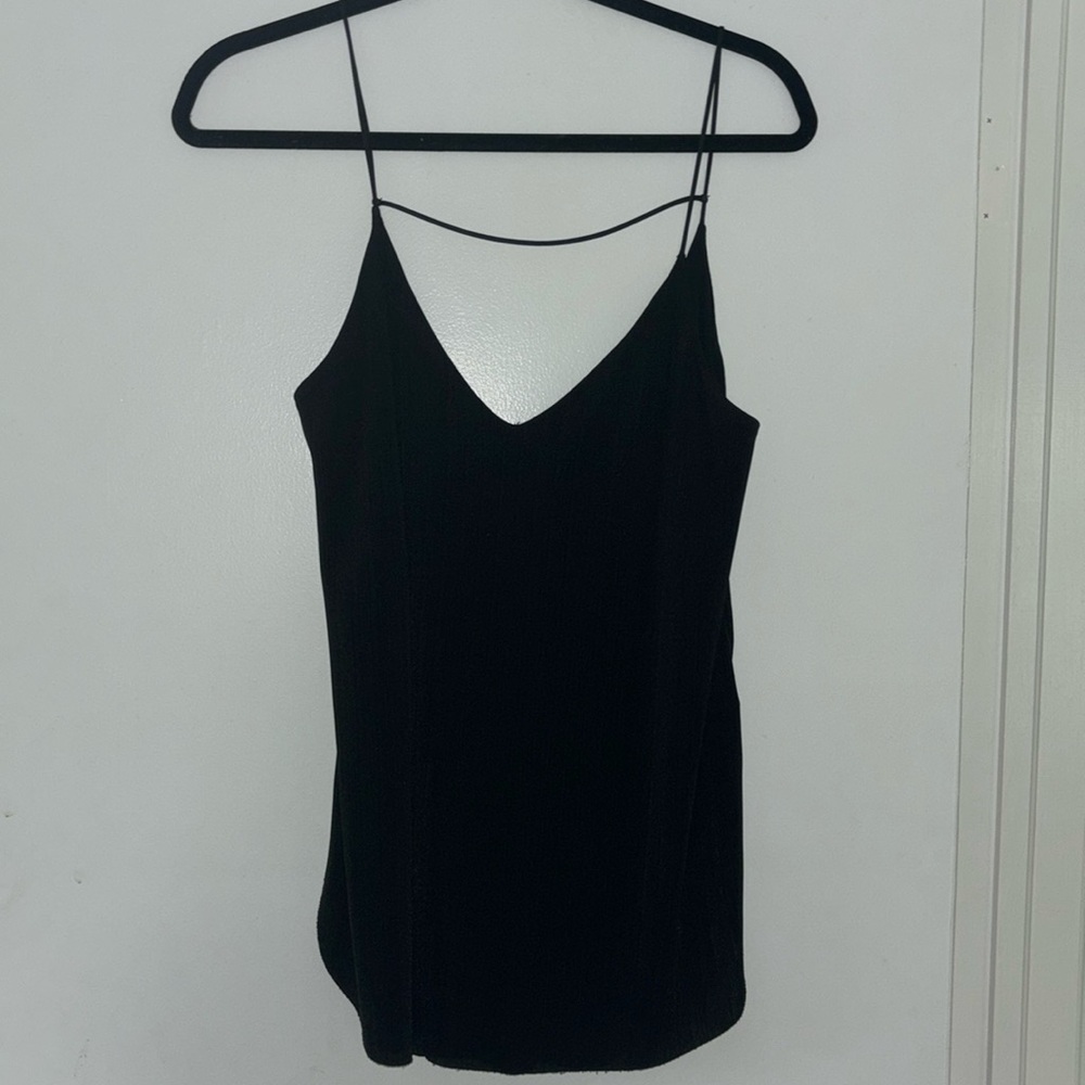 Black flowy camisole top with deep V back. Lightly worn and zero pulls